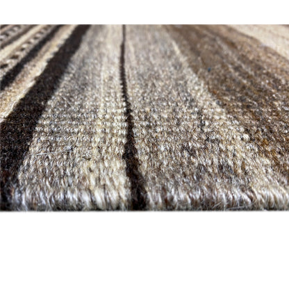 Close-up of the carpet surface with dense pile and patterned stripes