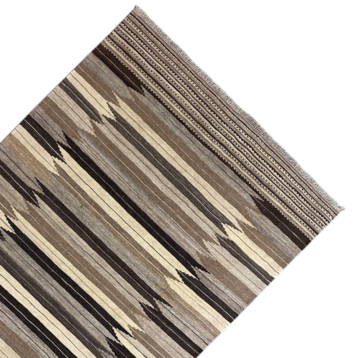 Rug in diagonal view with line and zigzag stripes, border with fine lines