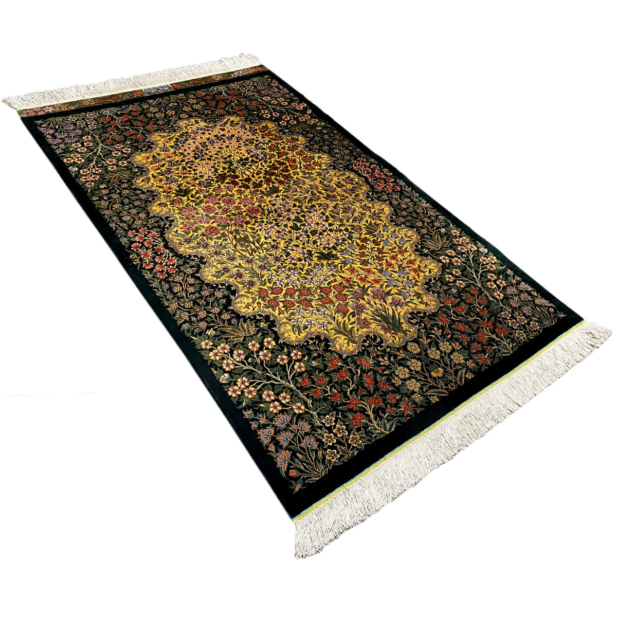 Rectangular silk rug with a floral medallion, dark green, yellow and red accents, fringe