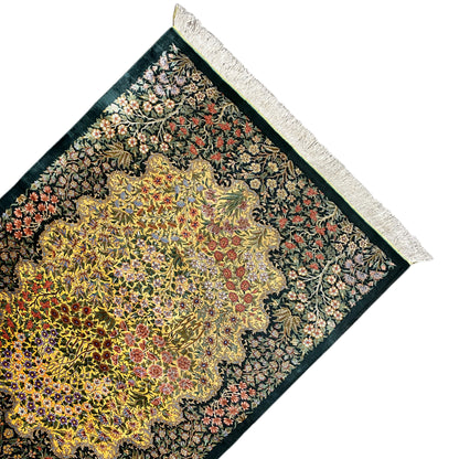 Corner silk rug with a yellow floral medallion, dark green, white fringe