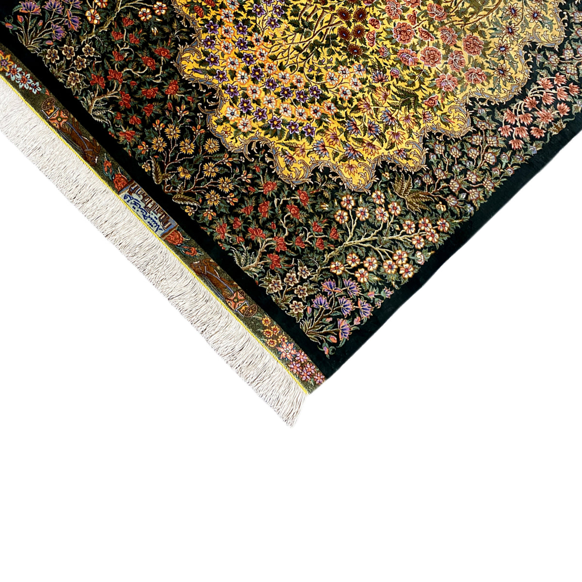 Corner silk rug with yellow center, dense botanical pattern, white fringes