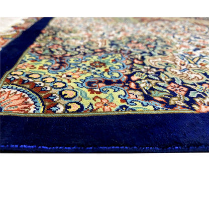 Ghom rug 156x102 cm: Detail with colorful ornamentation and dark blue border