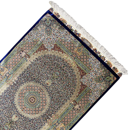 Ghom rug 156x102 cm with decorative pattern, medallions, and beige fringes along the edge