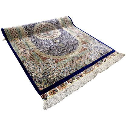 Rug 156x102 cm, top view; medallion ornament in blue, beige, and green