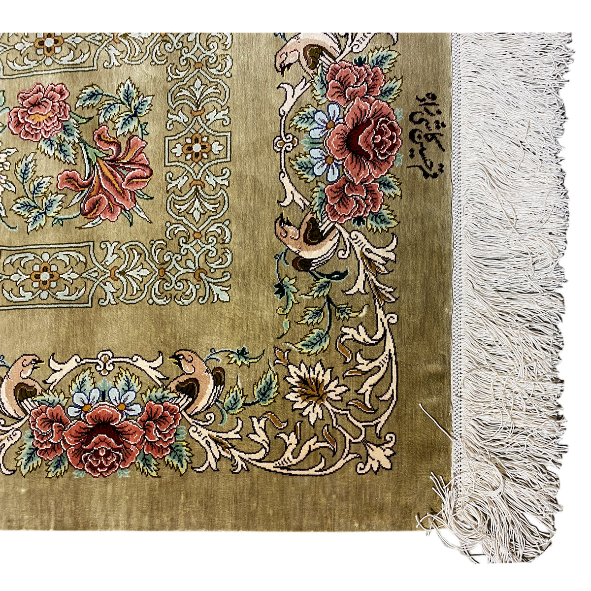 Close-up of a silk rug at the edge: large flowers in the pattern, olive-brown background, fringes