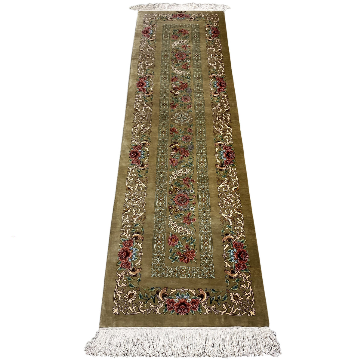 Silk runner rug with a light border pattern, colorful floral ornaments, and fringes at the bottom