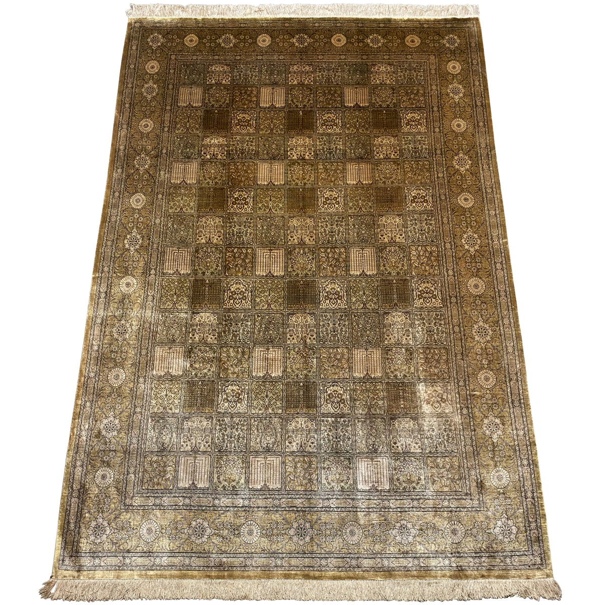 Rug with a square patchwork design in brown and beige, ornamental border and fringes