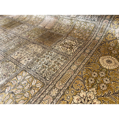 Close-up: Ghom rug with an ornamental patchwork pattern in beige, brown, and gold