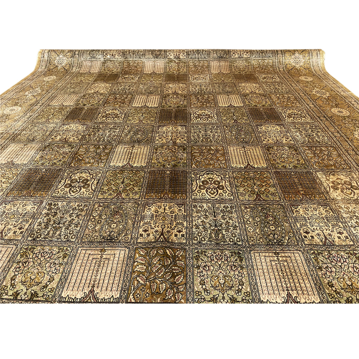 Close-up of the rug surface: many patchwork elements in beige and brown, with clearly framed motifs