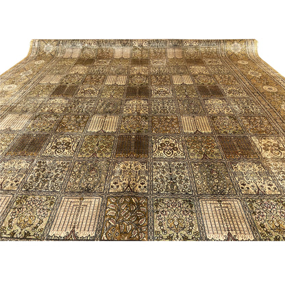 Close-up of the rug surface: many patchwork elements in beige and brown, with clearly framed motifs