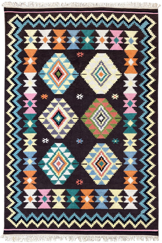 Wool rug with a colorful tribal pattern and light-colored fringe along the edge