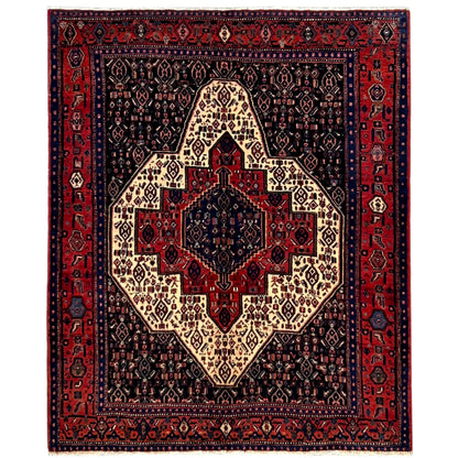 Patterned rectangular rug with a medallion in dark blue, red, and beige.