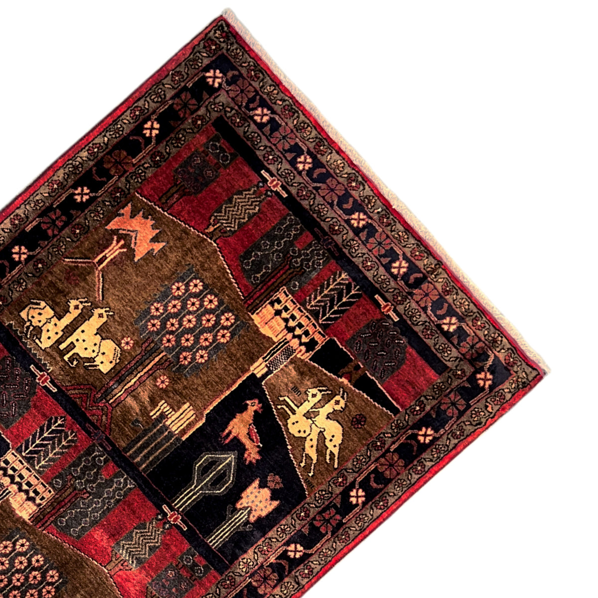Detailed view: rectangular rug with a border trim and patchwork ornaments in brown