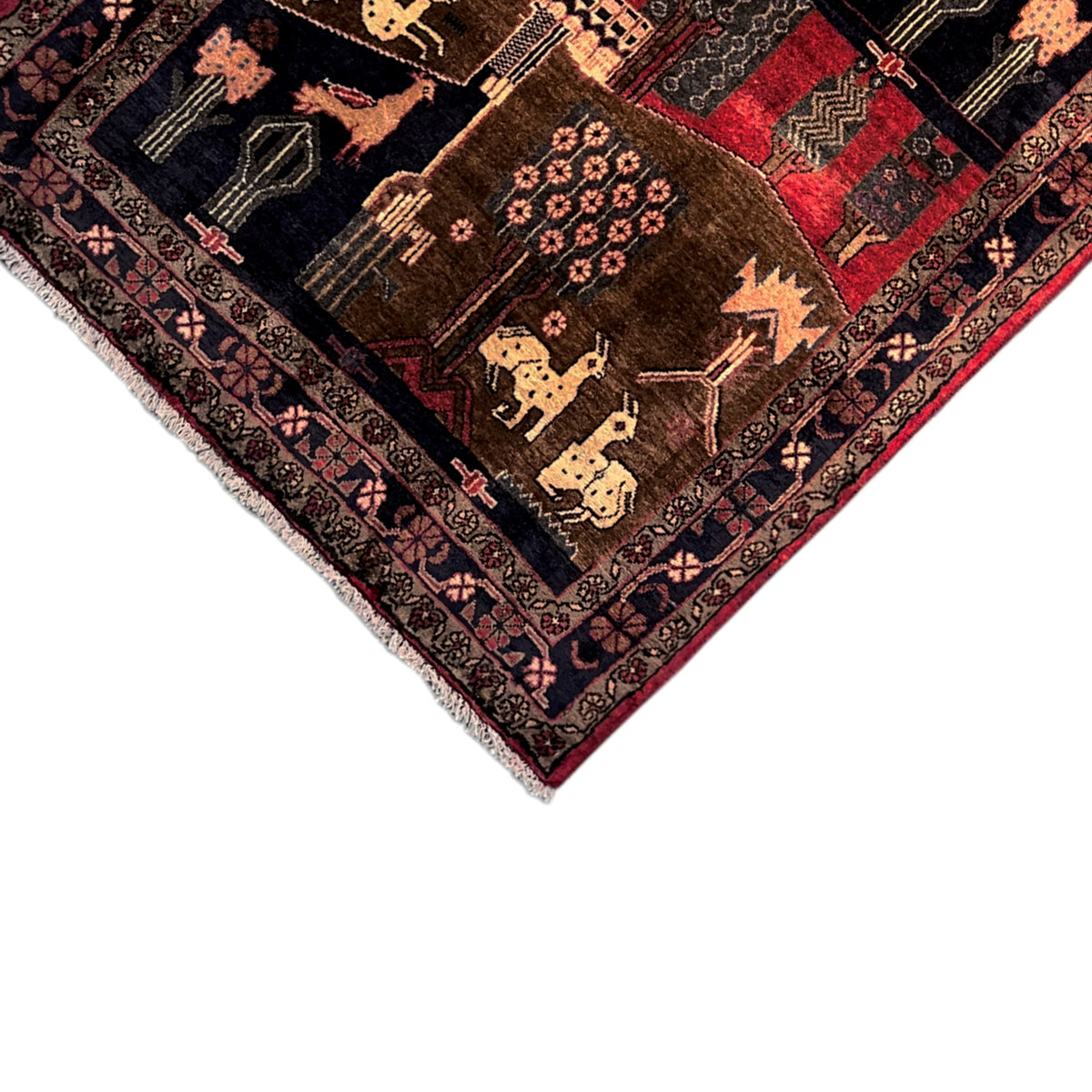 Corner of the rug with a bound border, animal motifs and ornaments in dark brown