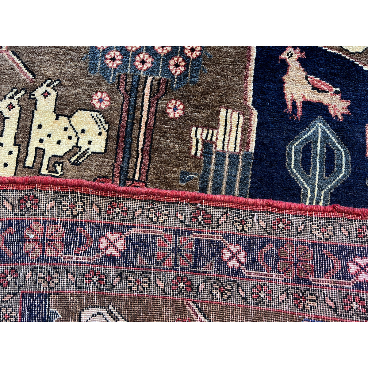Close-up of the middle section: carpet pattern with decorative elements in blue, brown, and red