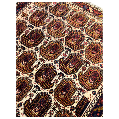 Shahre Babak carpet (154x105 cm), close-up with many dark medallions on a light background