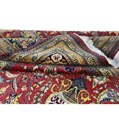 Shahreza carpet edge detail: frayed edge and colorful ornaments in blue and red
