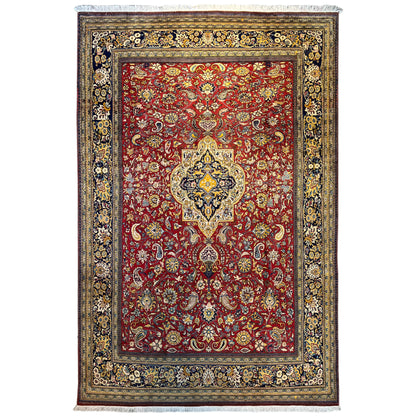 Shahreza rug with a red, blue-and-gold ornamental pattern and a wide decorative border