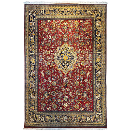Shahreza rug with a red, blue-and-gold ornamental pattern and a wide decorative border