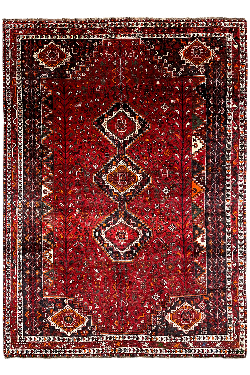 Red Oriental rug with medallions, a delicate ornamental pattern, and a framed border
