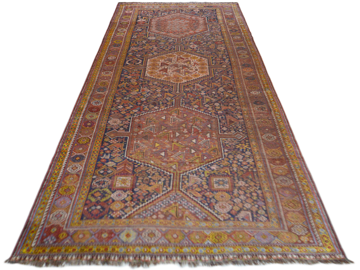 Rectangular oriental rug with a colorful vine and medallion pattern, 455x194 cm