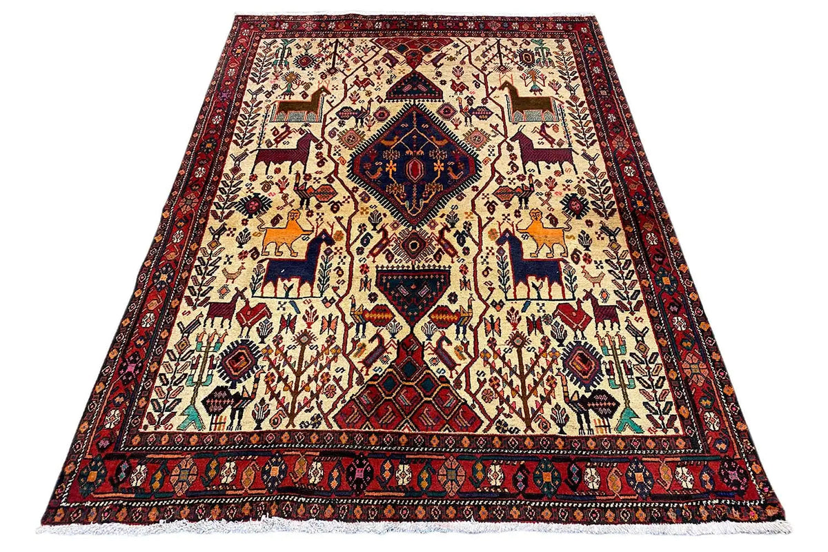 Rug with a geometric animal and vine motif, red border, and light background