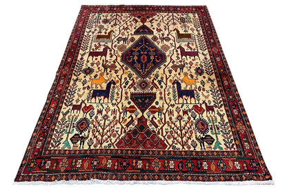 Rug with a geometric animal and vine motif, red border, and light background