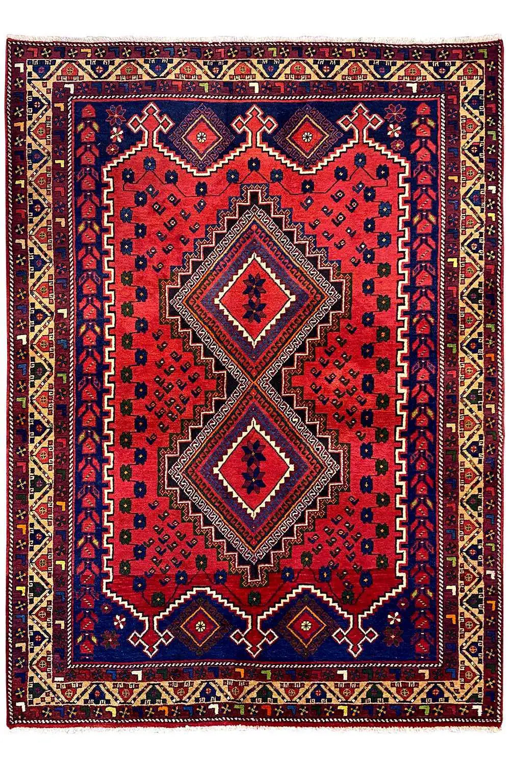 Oriental rug: red field with a blue central area, two diamond medallions, and border