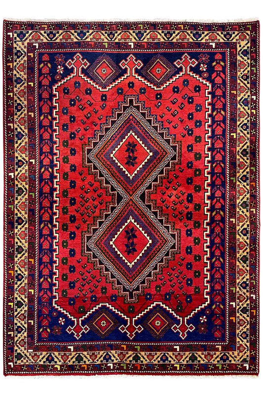 Oriental rug: red field with a blue central area, two diamond medallions, and border