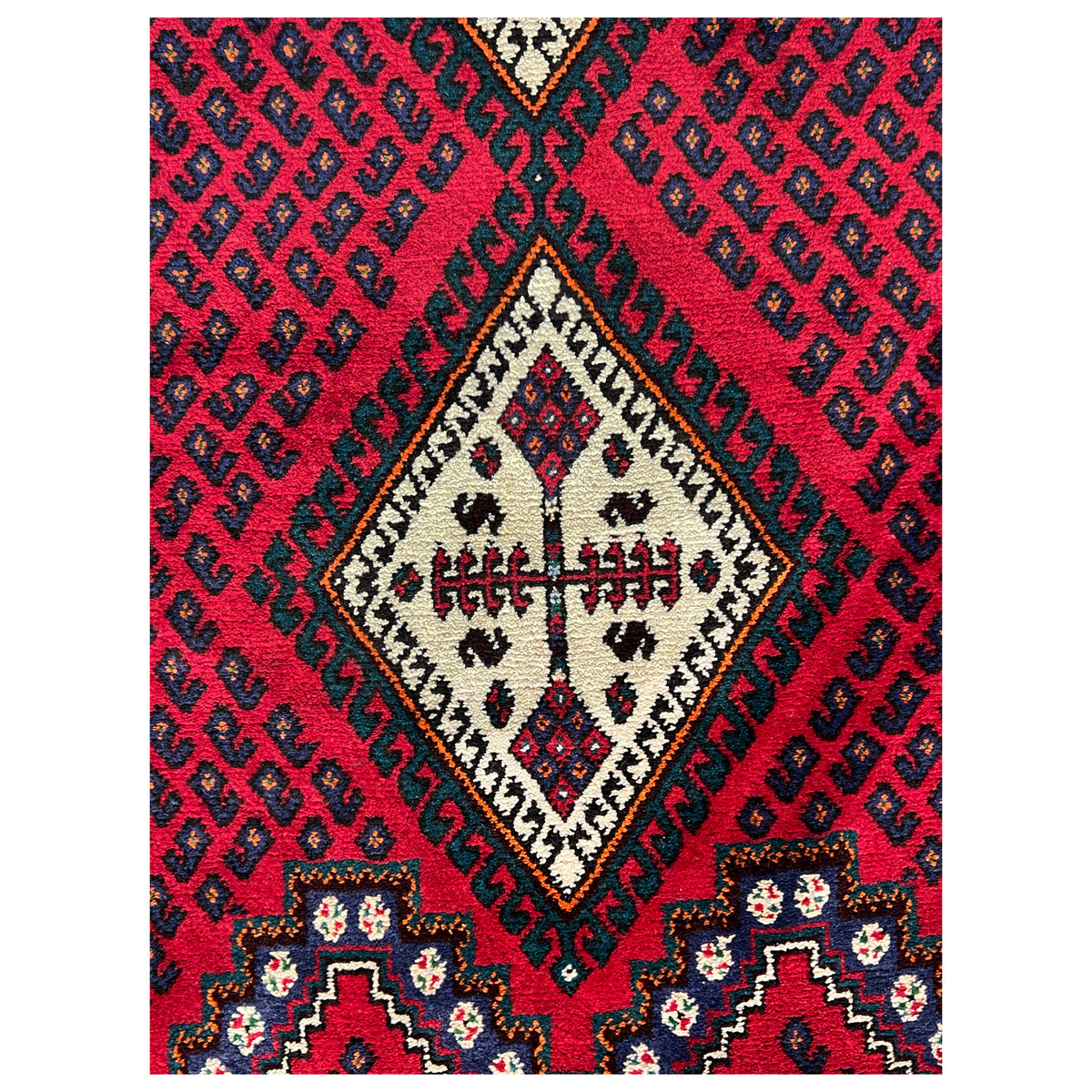 Red carpet section with diamonds, zigzag patterns, and cream details