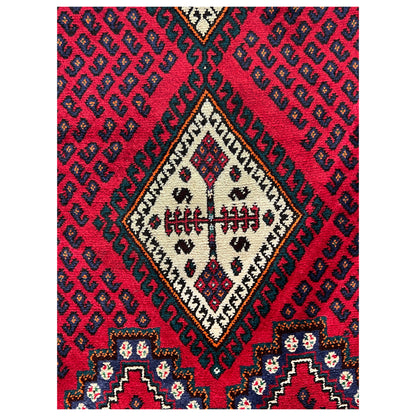 Red carpet section with diamonds, zigzag patterns, and cream details