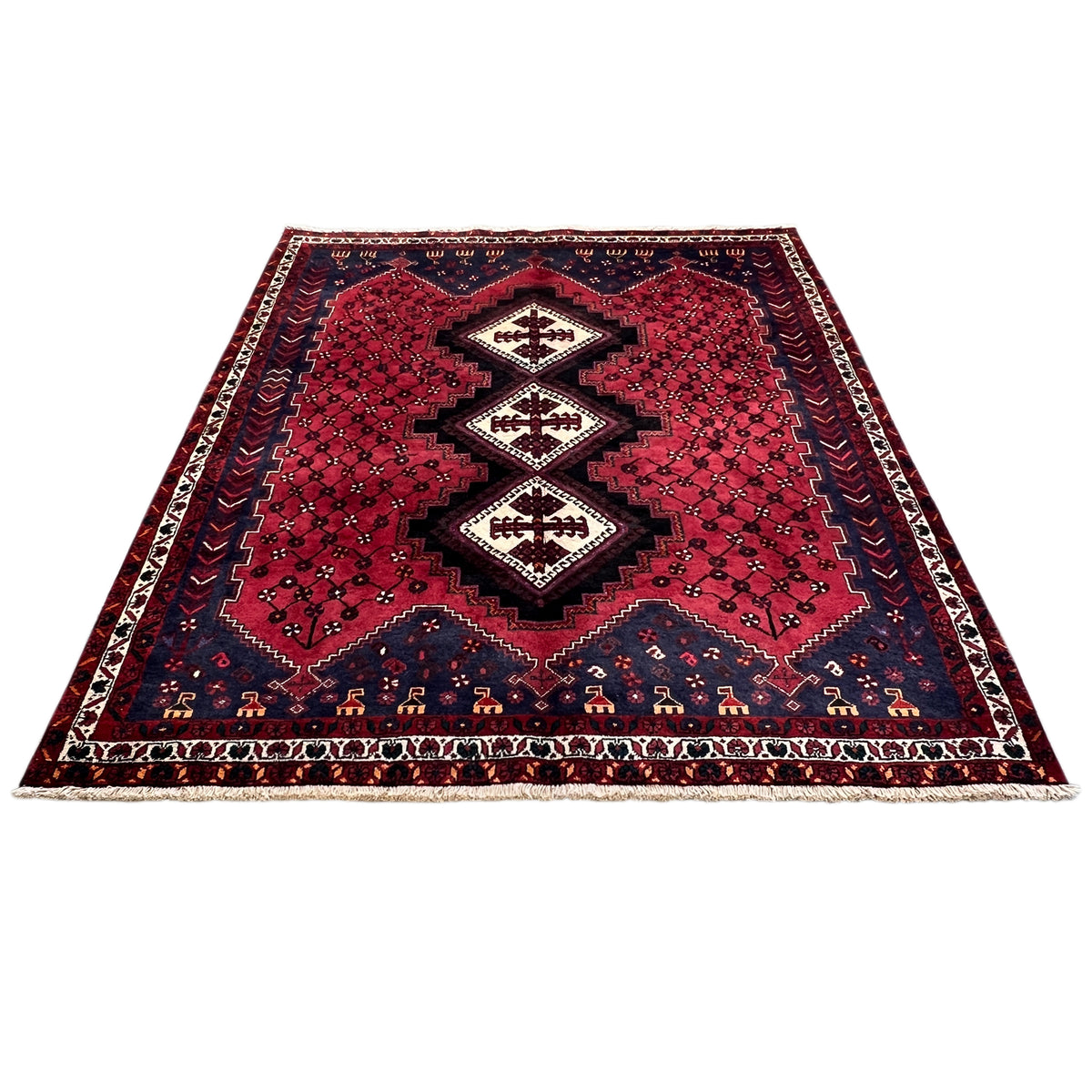 Sirjan rug, red ground with a geometric pattern and dark blue borders