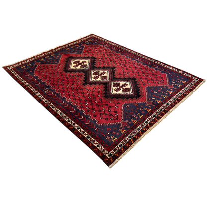 Sirjan rug in red and dark blue with central medallions and a narrow border