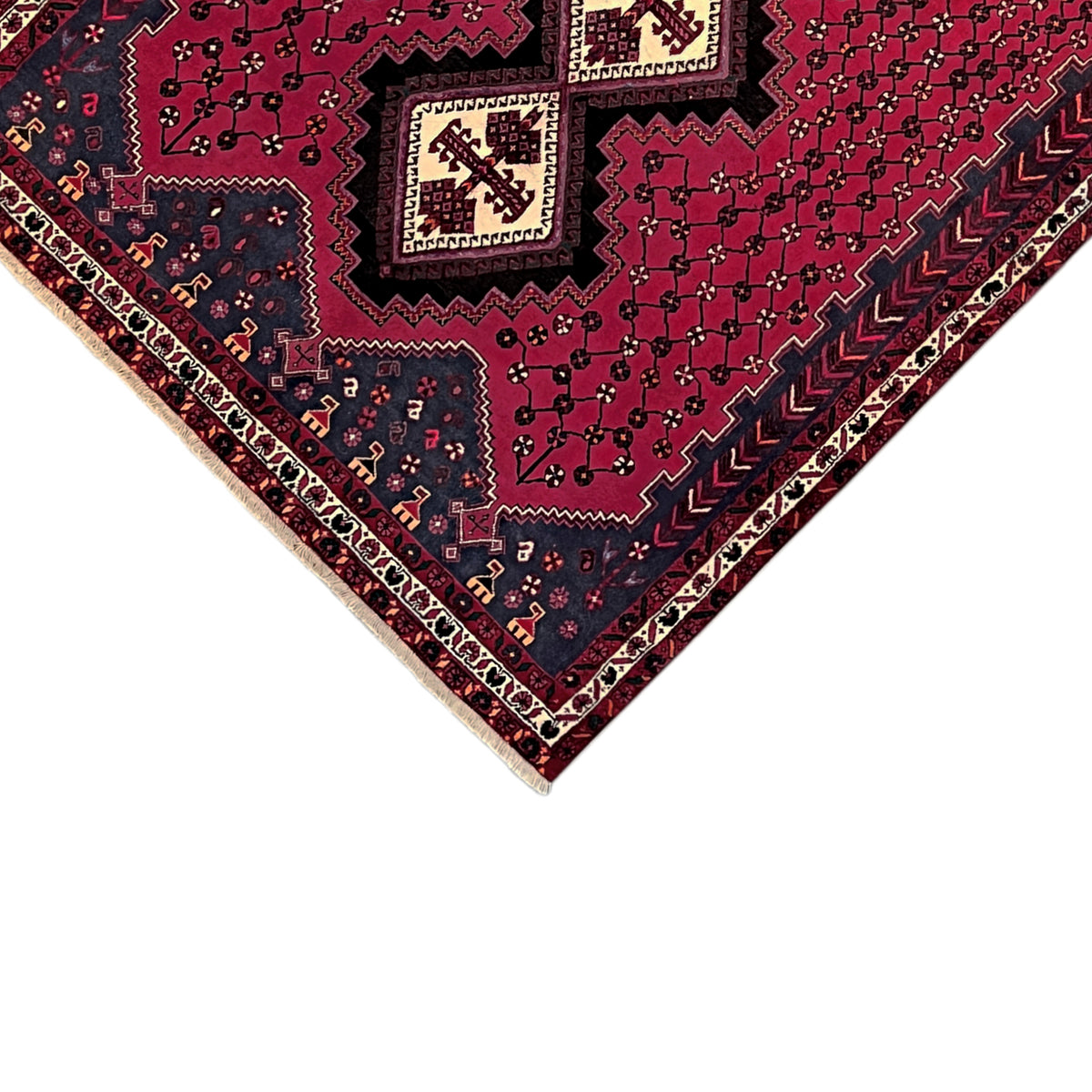 Carpet corner with a border in white and dark blue, featuring a red geometric ornament