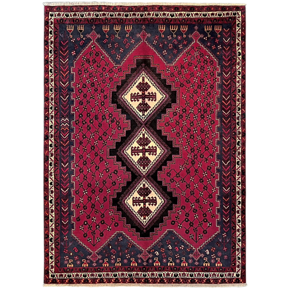 Sirjan rug with a red pattern and dark blue border, centrally embedded medallions
