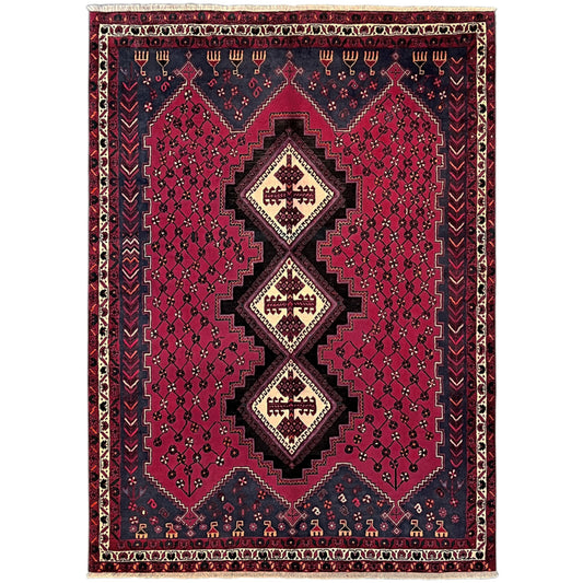 Sirjan rug with a red pattern and dark blue border, centrally embedded medallions