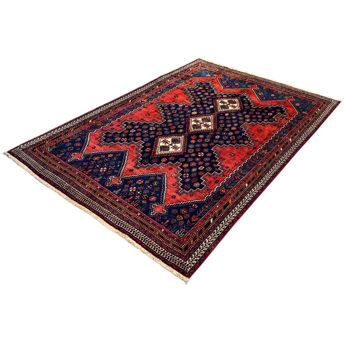 Oriental rug with a geometric pattern in red, blue, and dark brown