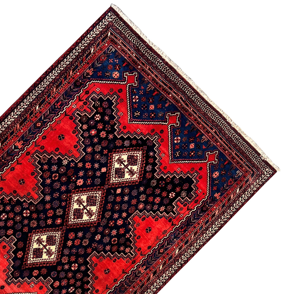 Triangular image section: Oriental rug pattern with red fields and blue border