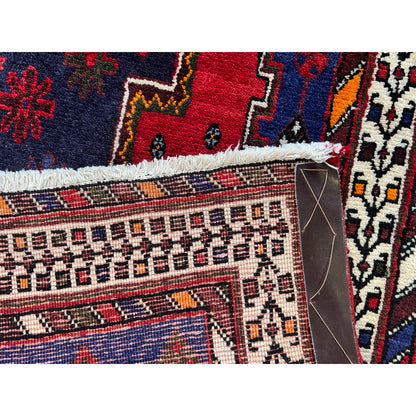Runner rug with multicolored detailed patterns, graduated border, and short edge