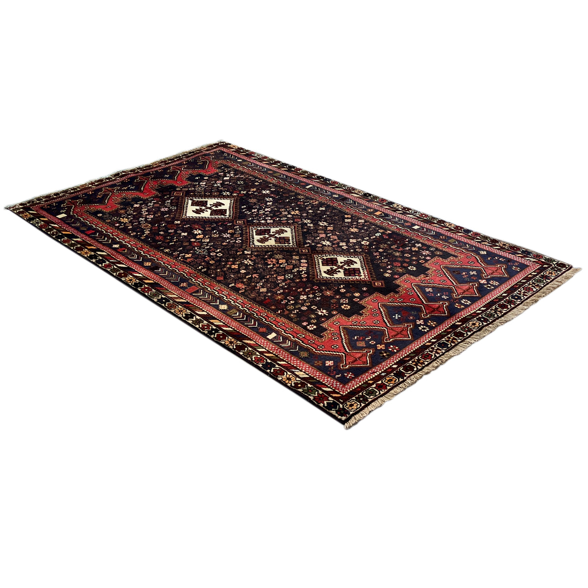 Sirjan rug with a diagonal view of geometric ornaments in dark brown and reddish blue