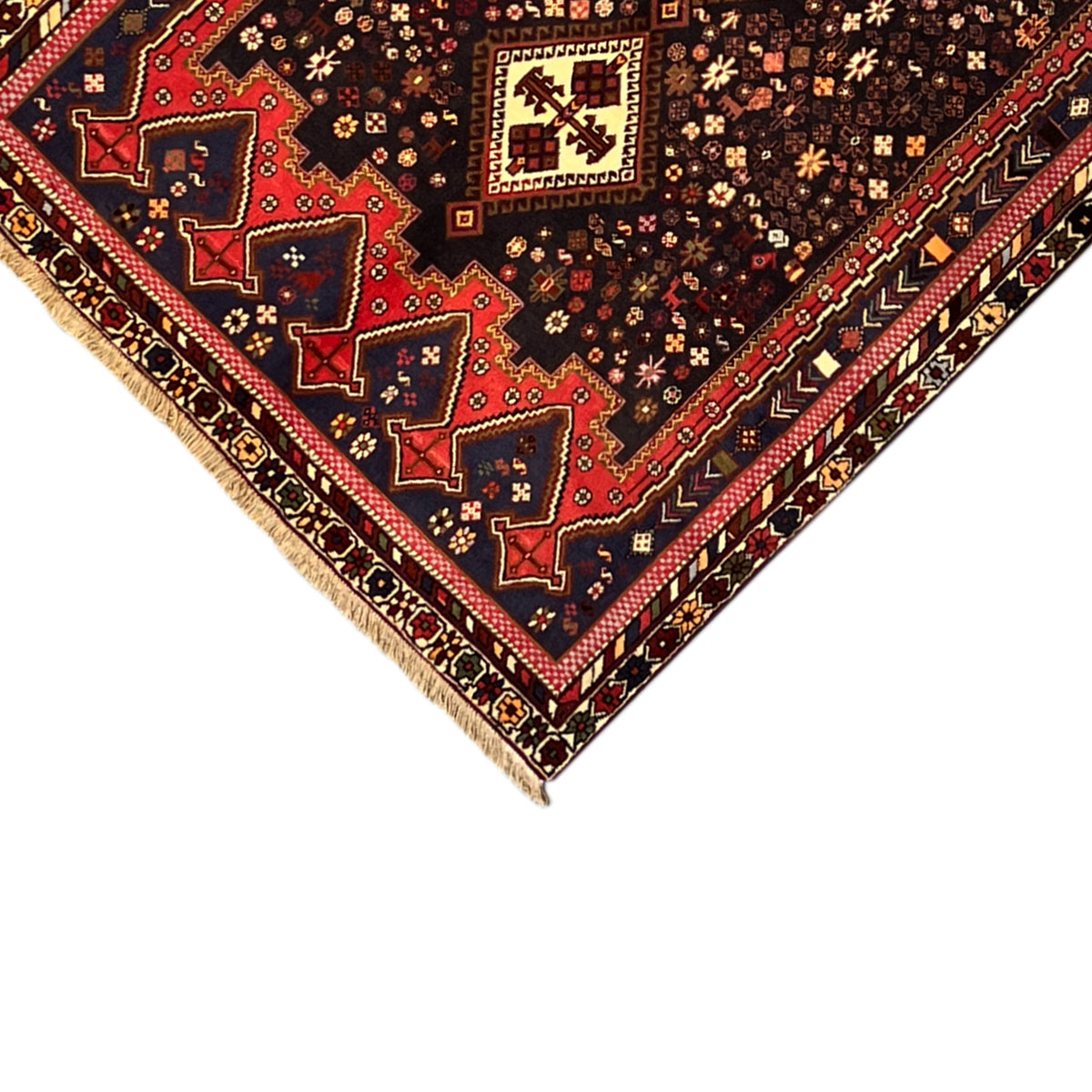 Sirjan carpet corner in 3/4 view with decorative border and multicolored ornaments