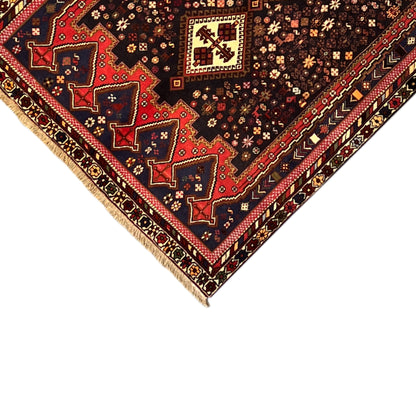 Sirjan carpet corner in 3/4 view with decorative border and multicolored ornaments