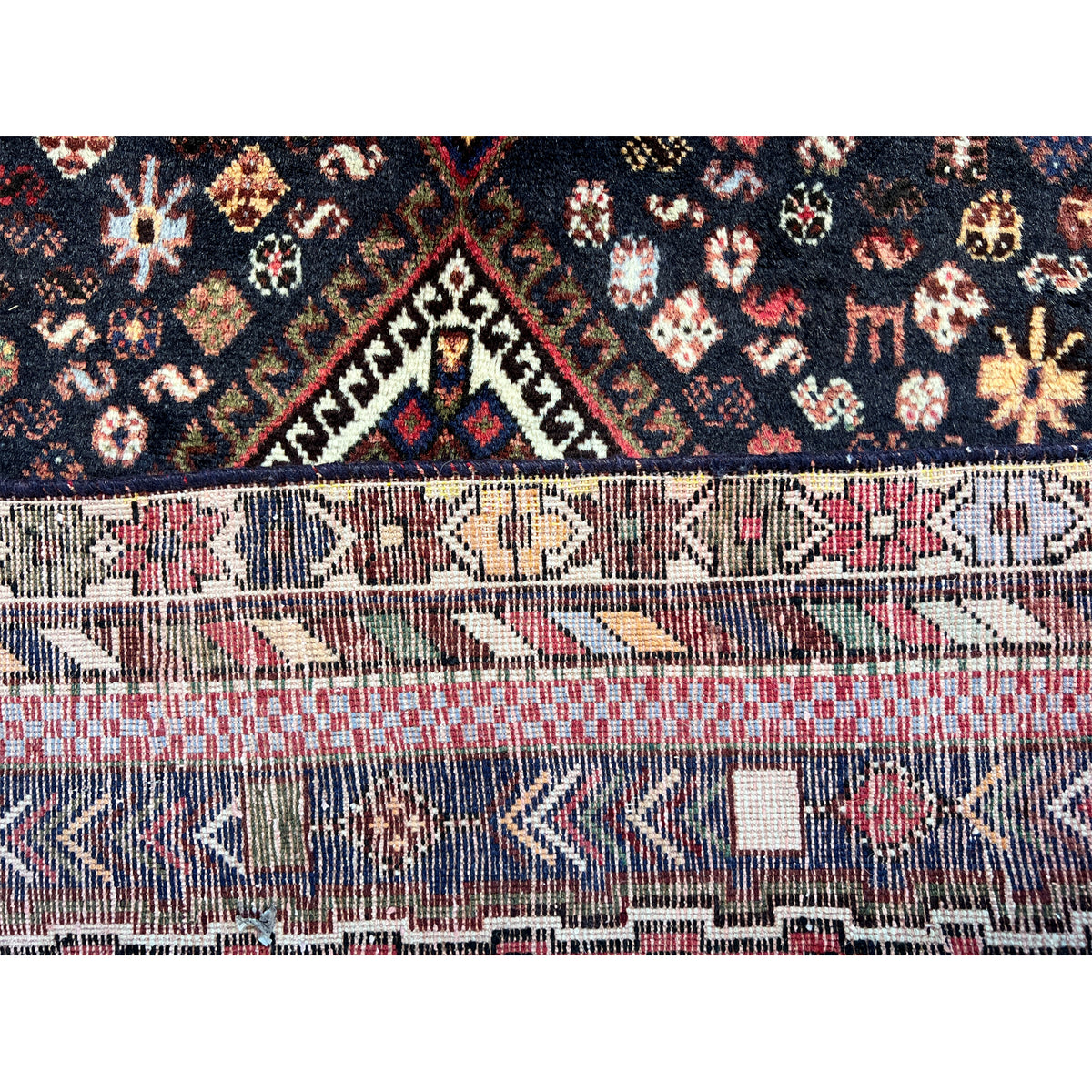 Sirjan rug pattern finish: border with striped ornaments in red, blue, beige