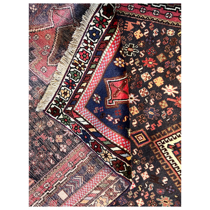 Sirjan carpet detail near the edge with ornamental borders and fringes, dark brown/multicolored