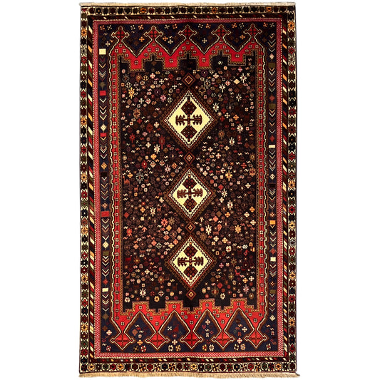 Sirjan rug in dark brown with red-blue ornaments and central medallions, 244x143 cm
