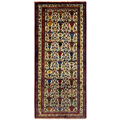 Sirjan rug with a border in red and a multicolored ornamental pattern on a light background