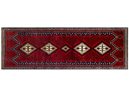 Narrow runner rug with a horizontal ornamental band and decorative borders in red and cream