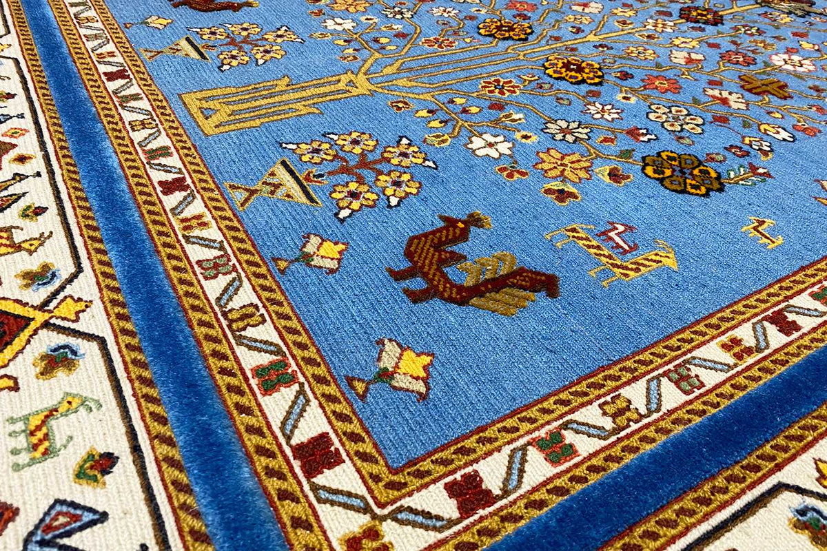 Close-up: blue carpet with floral ornaments and a narrow decorative border