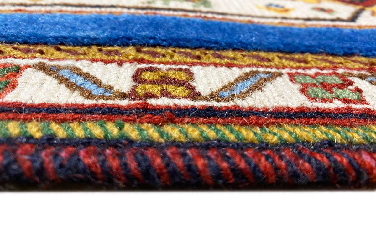 Rug detail: multicolored selvage and dense pile with a side finish