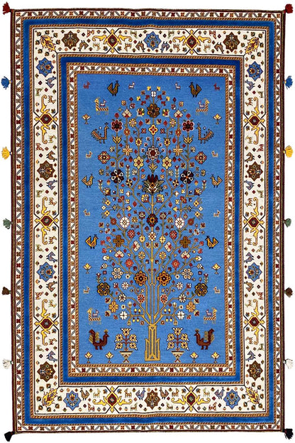 Blue oriental rug with decorative border, central medallion, and fringes